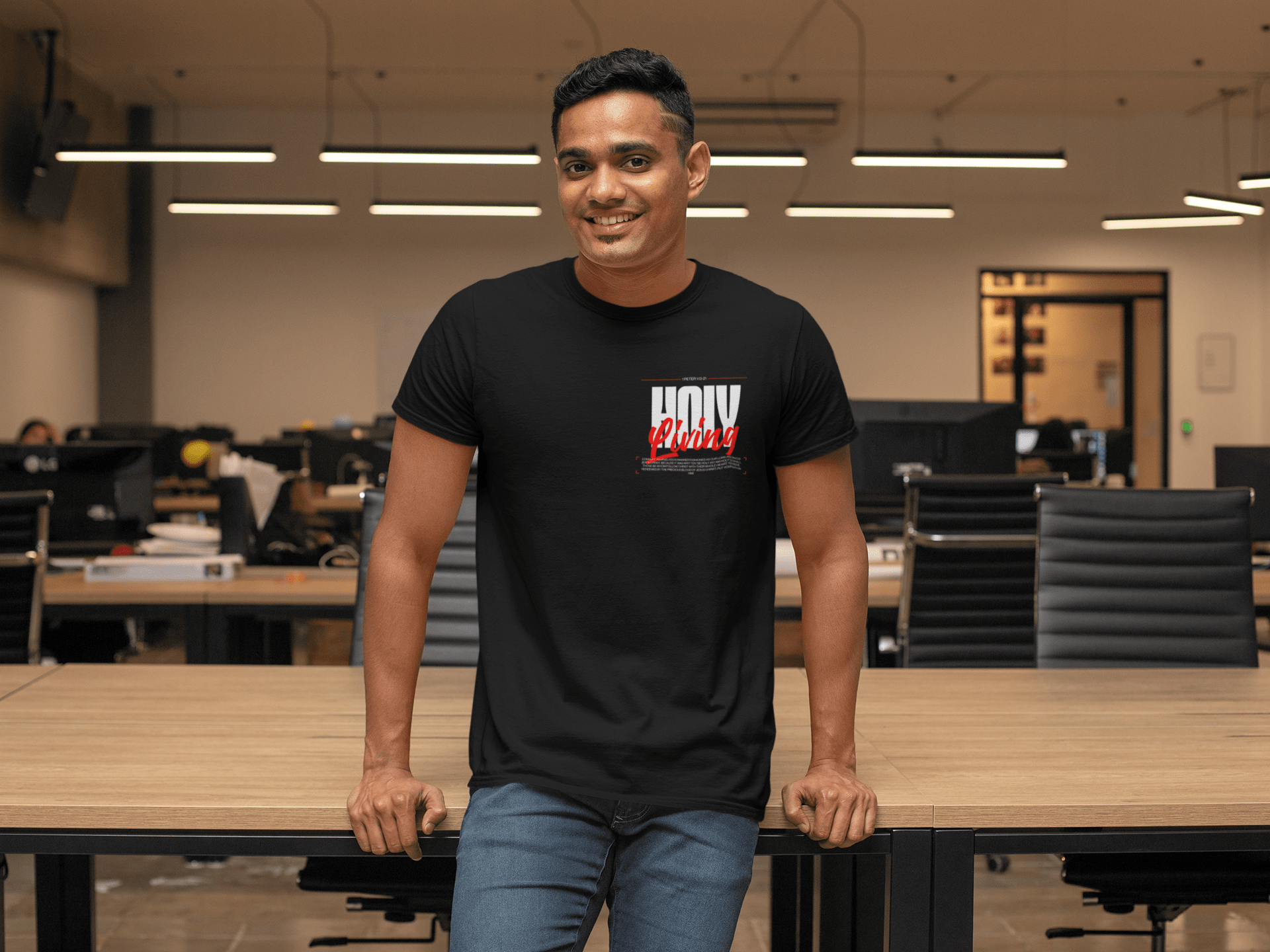 t-shirt-mockup-featuring-a-smiling-man-leaning-on-a-desk-at-the-office